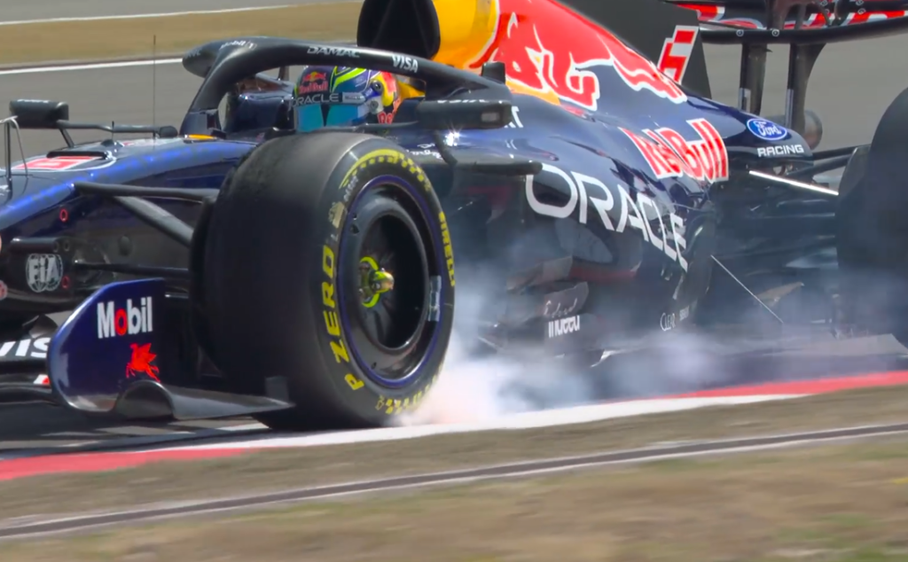 Isack Hadjar front left wheel lock turn 6 Isack Hadjar's Racing Bulls locking up at the front-left tyre through the braking zone at Turn 6 during Free Practice 1 at the 2025 Chinese Grand Prix in Shanghai.